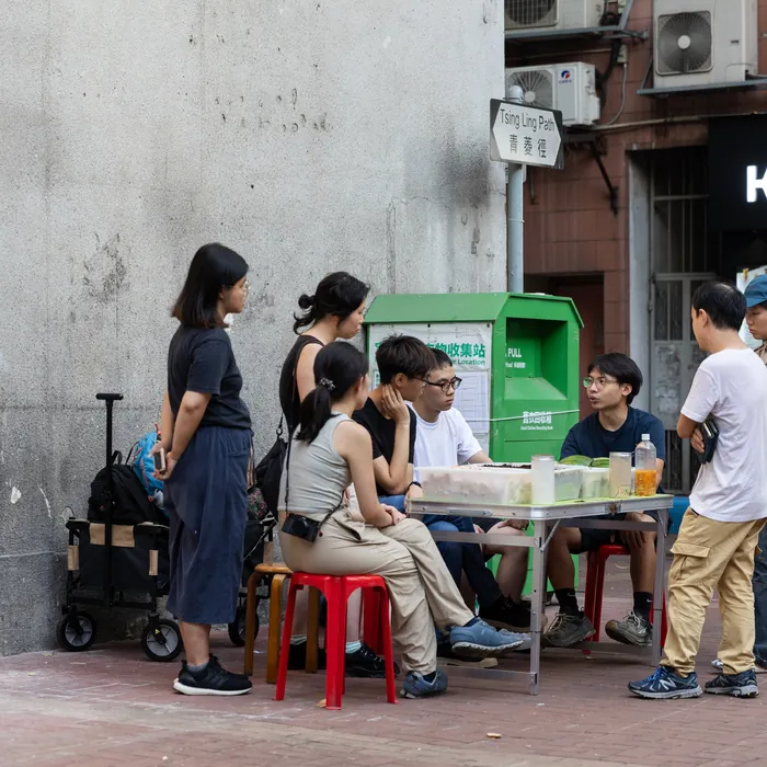 A researcher collecting from a partner shop